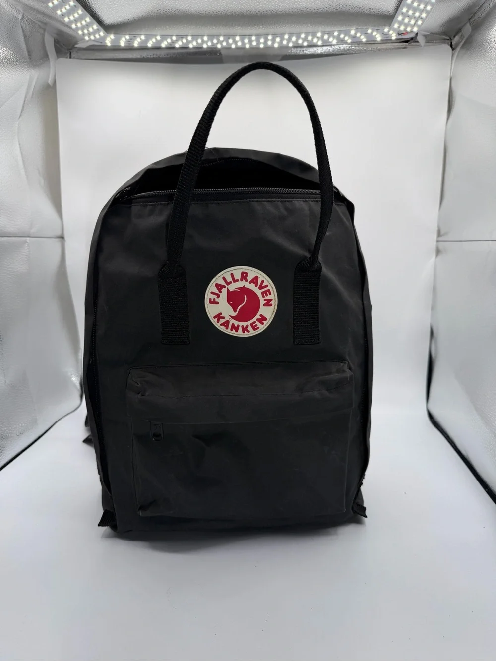Fjallraven Kånken Backpack in Black with Red and Cream Logo